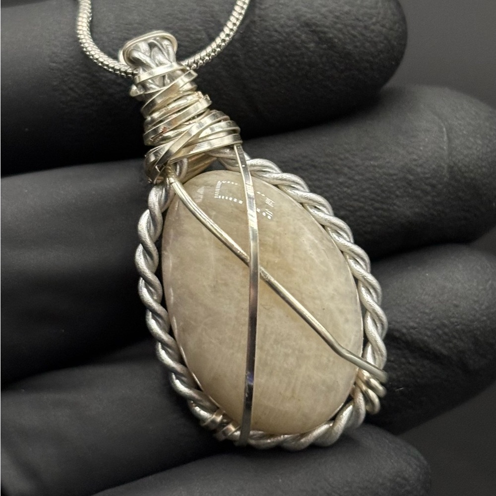 Elegant Silver Wrapped Stone Pendant